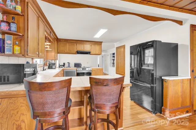 a living room with fireplace furniture and a window