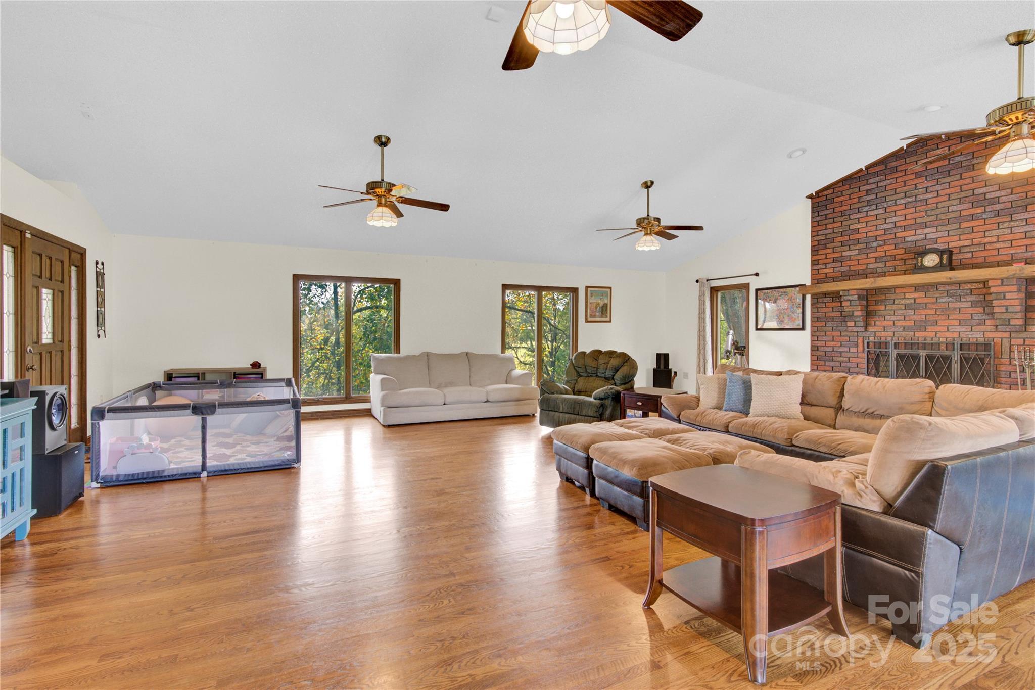 11720 Kluttz Road Gold Hill, NC 28071 - Photo 16 of 35 a living room with fireplace furniture and a wooden floor