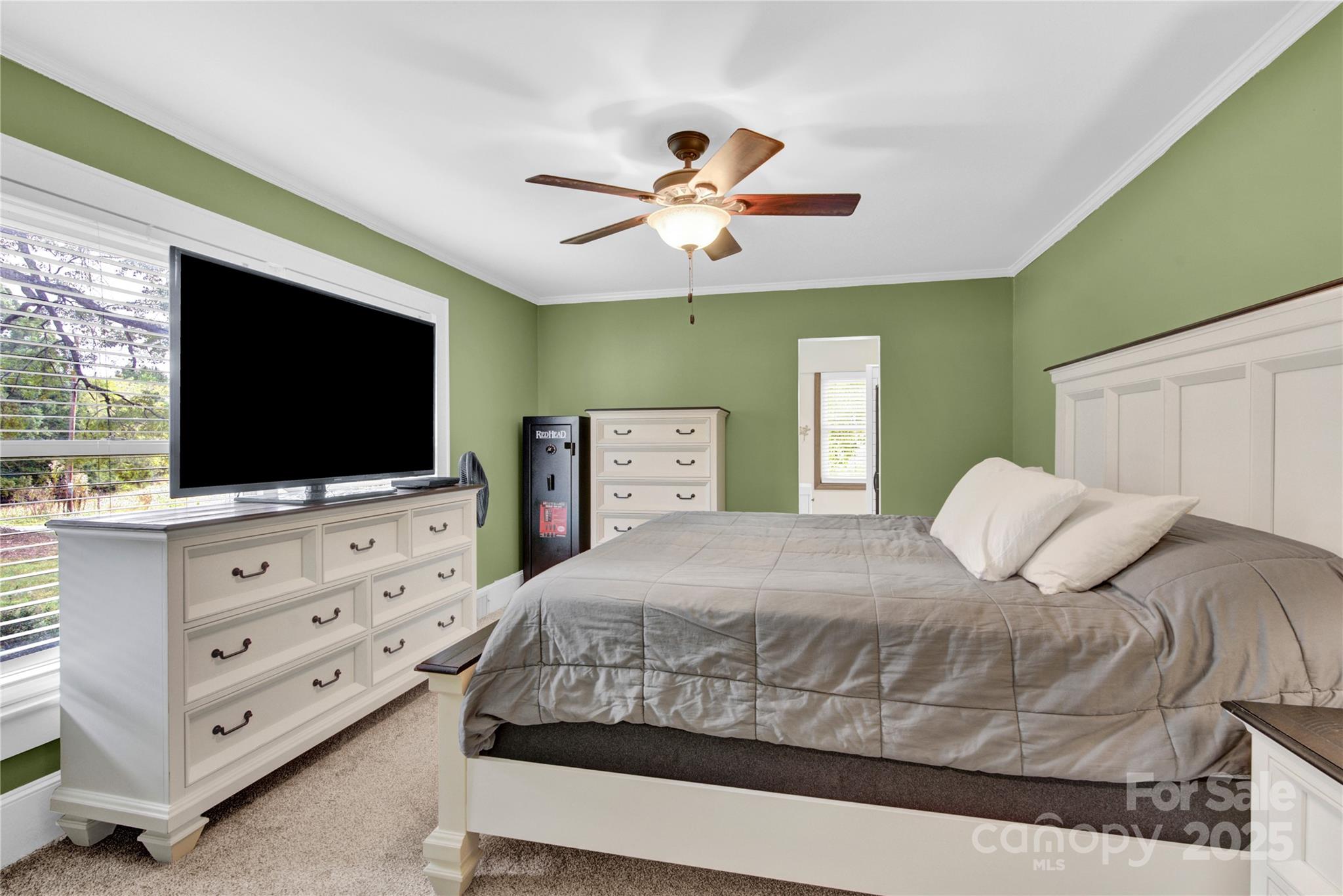 11720 Kluttz Road Gold Hill, NC 28071 - Photo 18 of 35 a bedroom with a bed and a flat screen tv