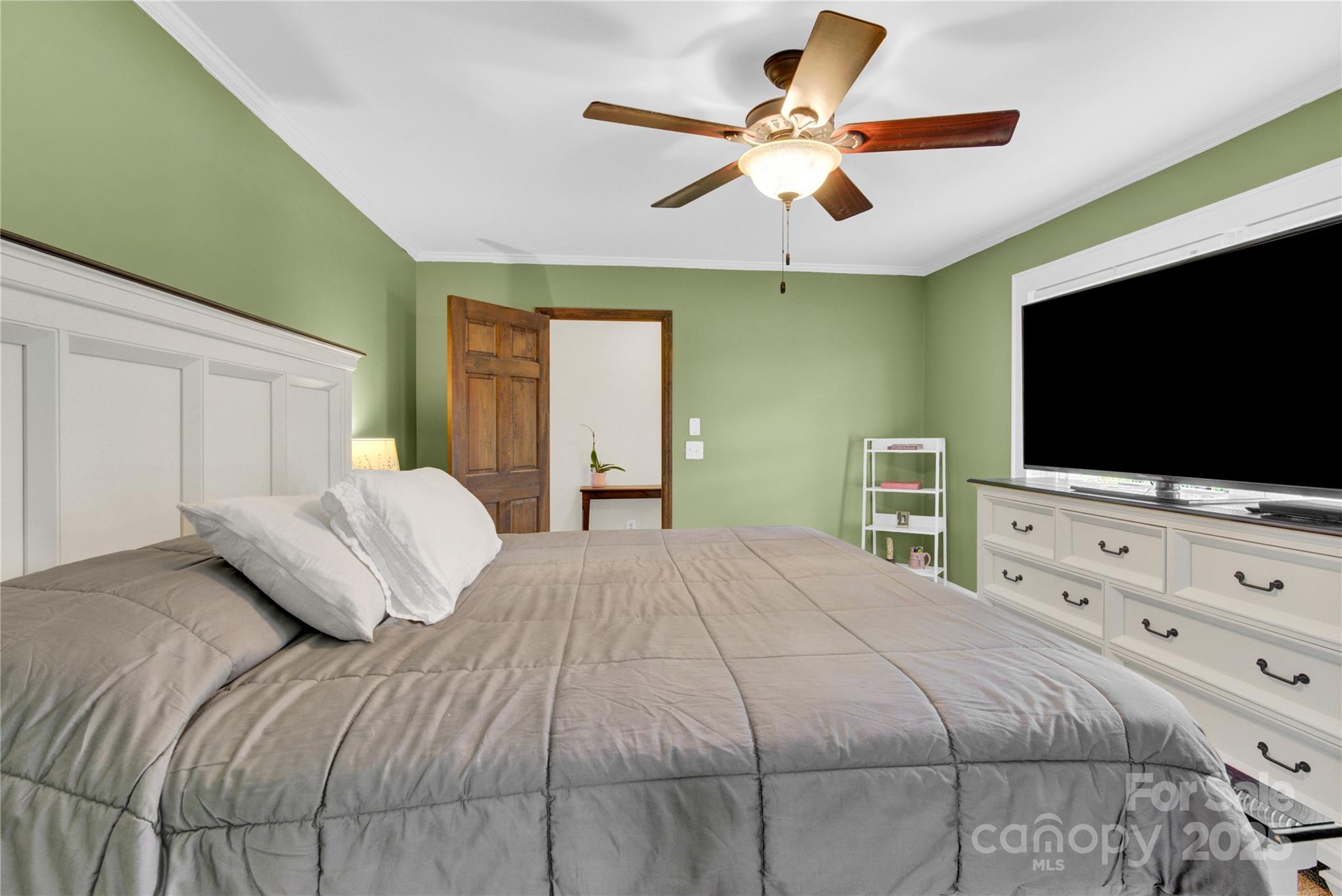 11720 Kluttz Road Gold Hill, NC 28071 - Photo 20 of 35 a bedroom with a bed and a flat screen tv on dresser