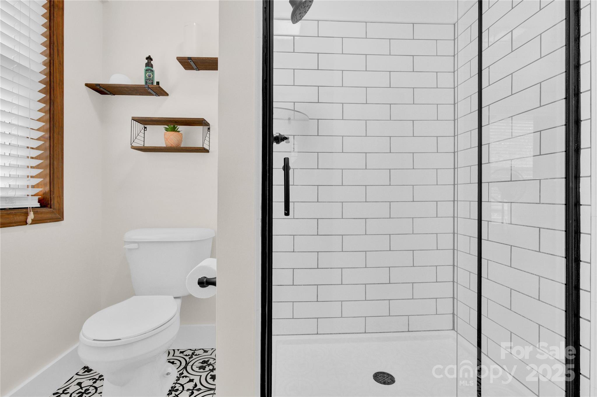 11720 Kluttz Road Gold Hill, NC 28071 - Photo 21 of 35 a bathroom with a shower and a toilet