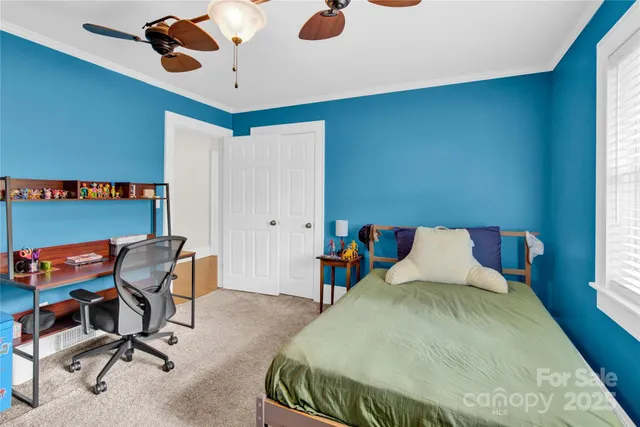 a bedroom with a bed furniture and a window