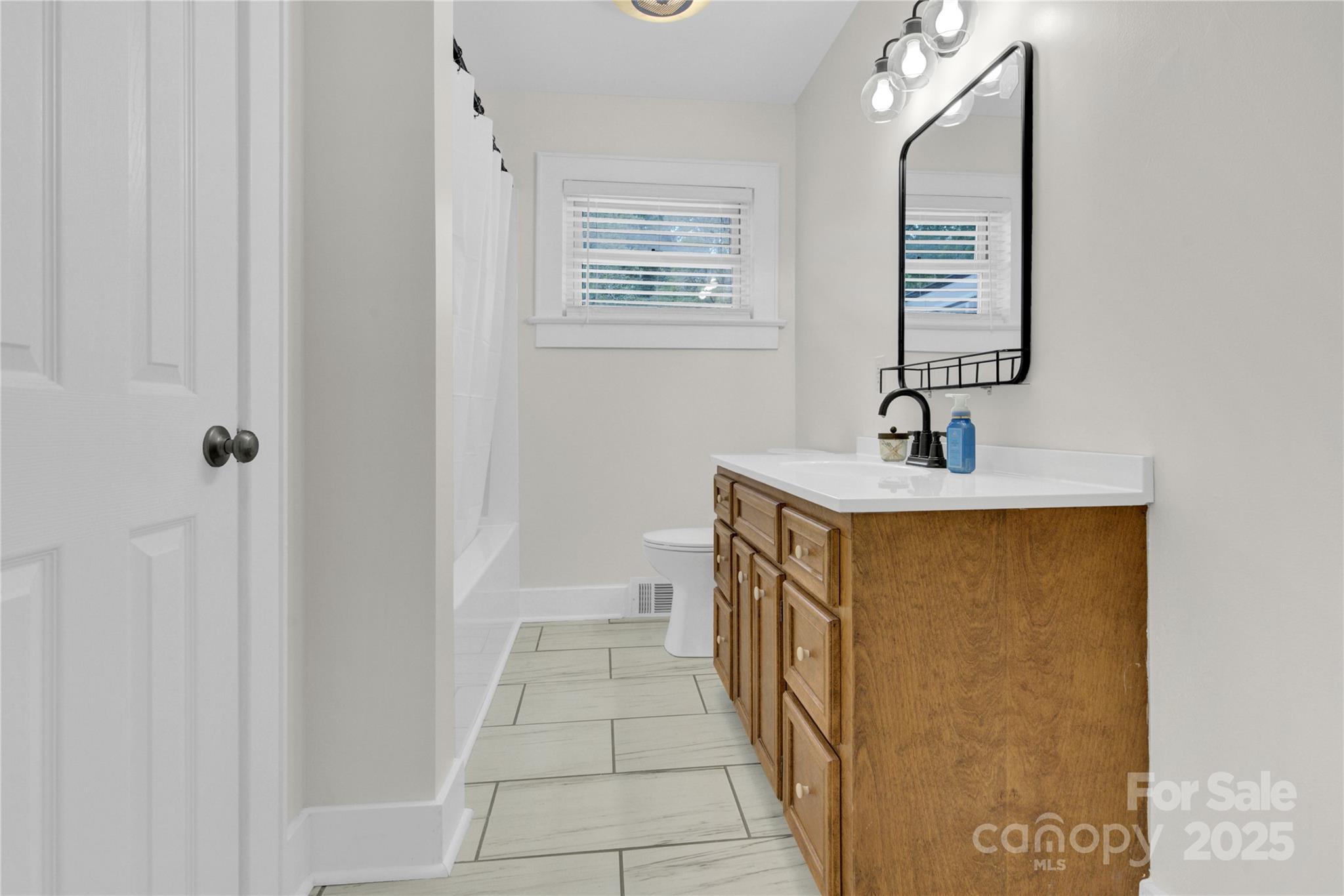 11720 Kluttz Road Gold Hill, NC 28071 - Photo 25 of 35 a bathroom with a sink and a mirror