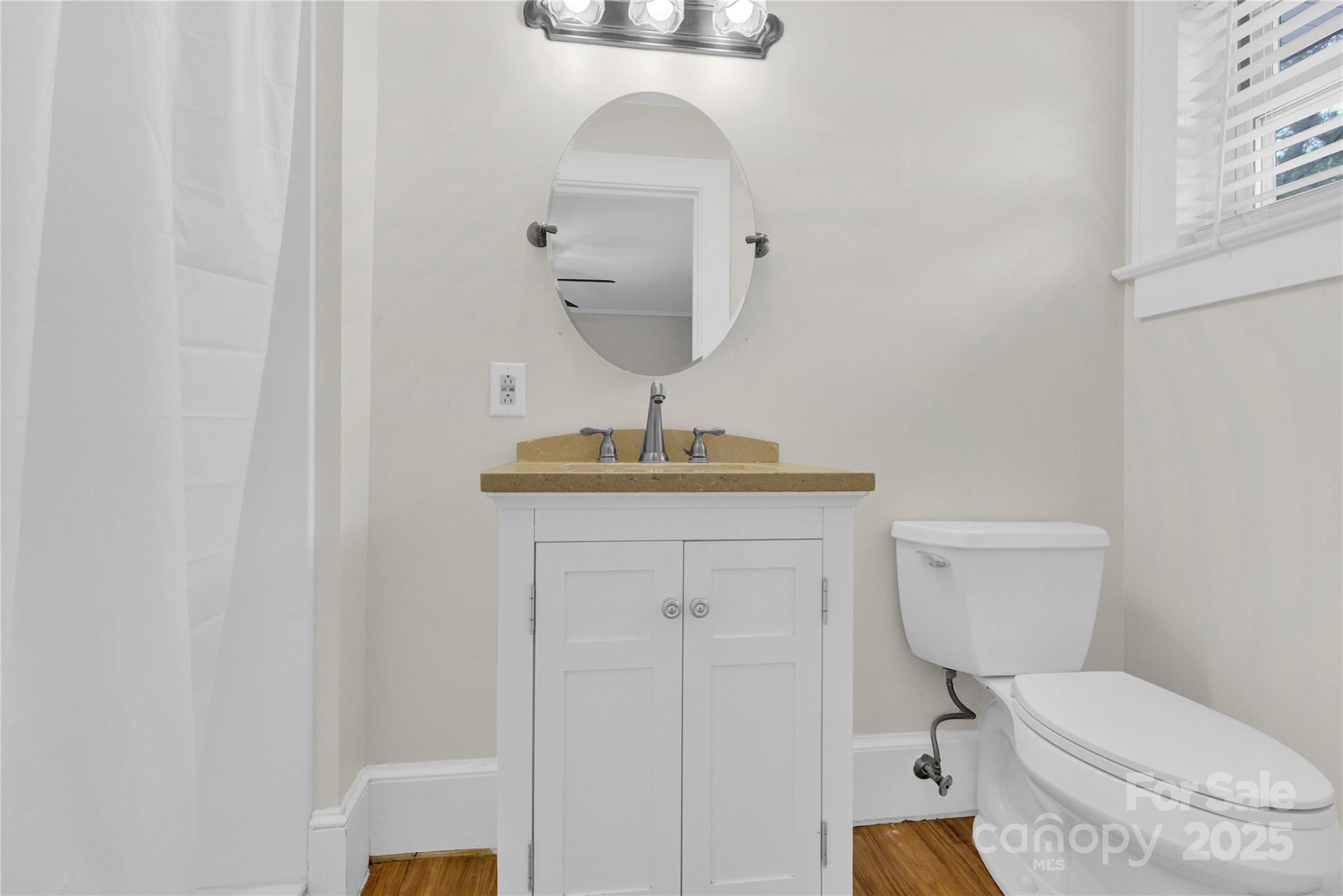 11720 Kluttz Road Gold Hill, NC 28071 - Photo 26 of 35 a bathroom with a toilet sink and mirror