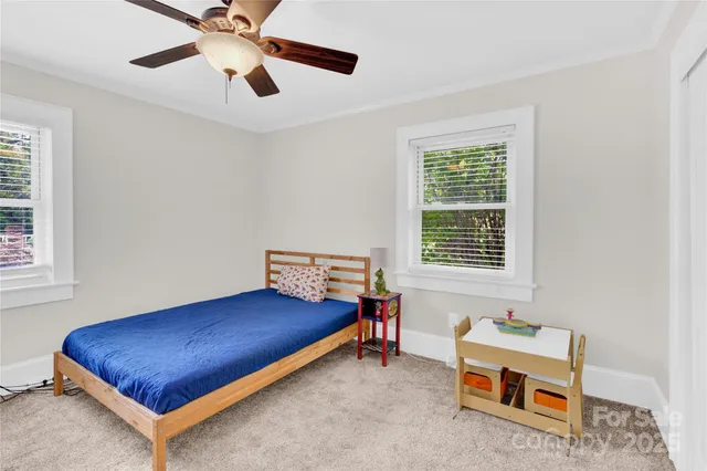 a room with a bed and a window