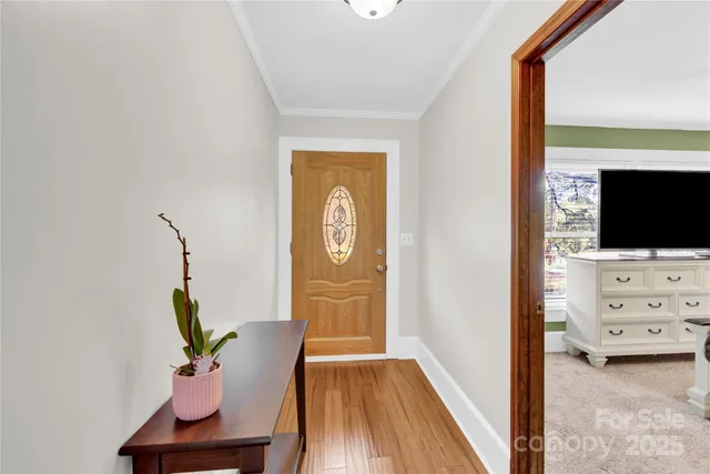 a view of living room with furniture and flat screen tv