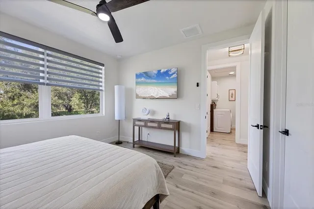 a bedroom with a bed and a window