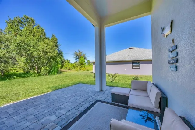 a view of a two chairs in the garden