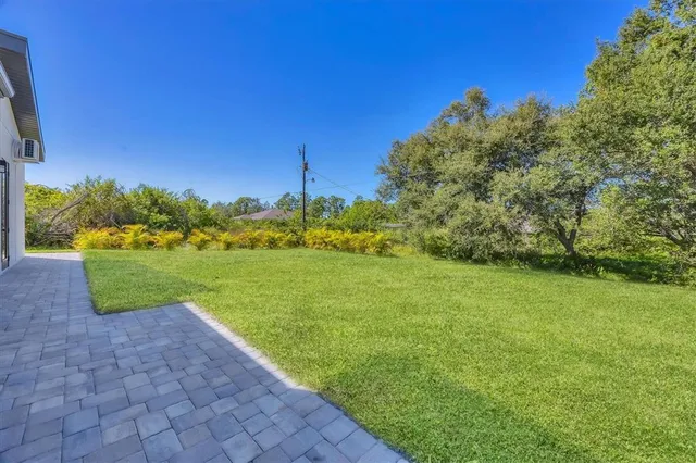 a view of a garden with a building in the background