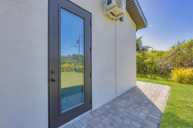 a living room with furniture and potted plant
