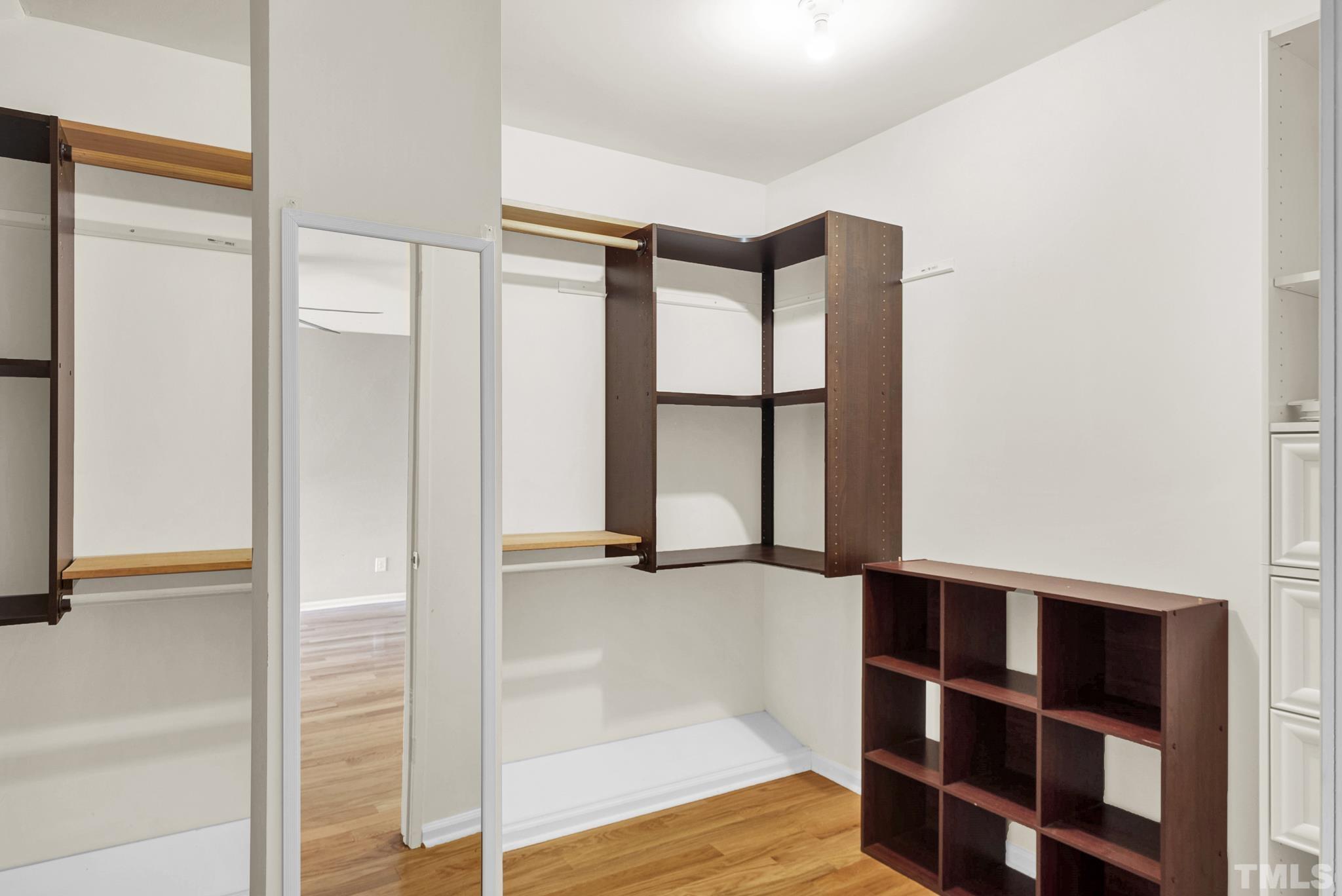 5 Intuition Circle Durham, NC 27705 - Photo 23 of 31 a view of walk in closet with empty racks