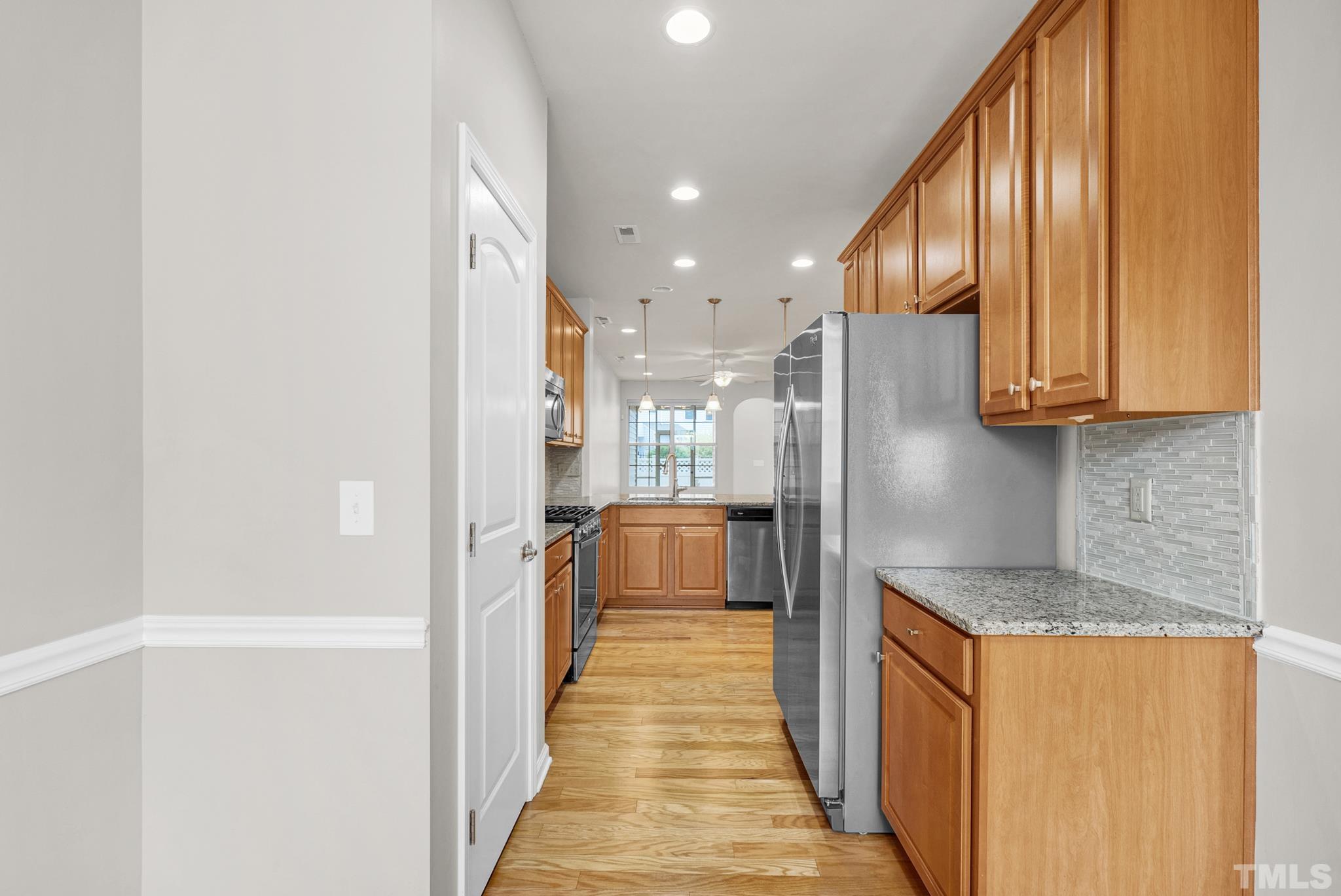 5 Intuition Circle Durham, NC 27705 - Photo 7 of 31 a view of a kitchen from the hallway