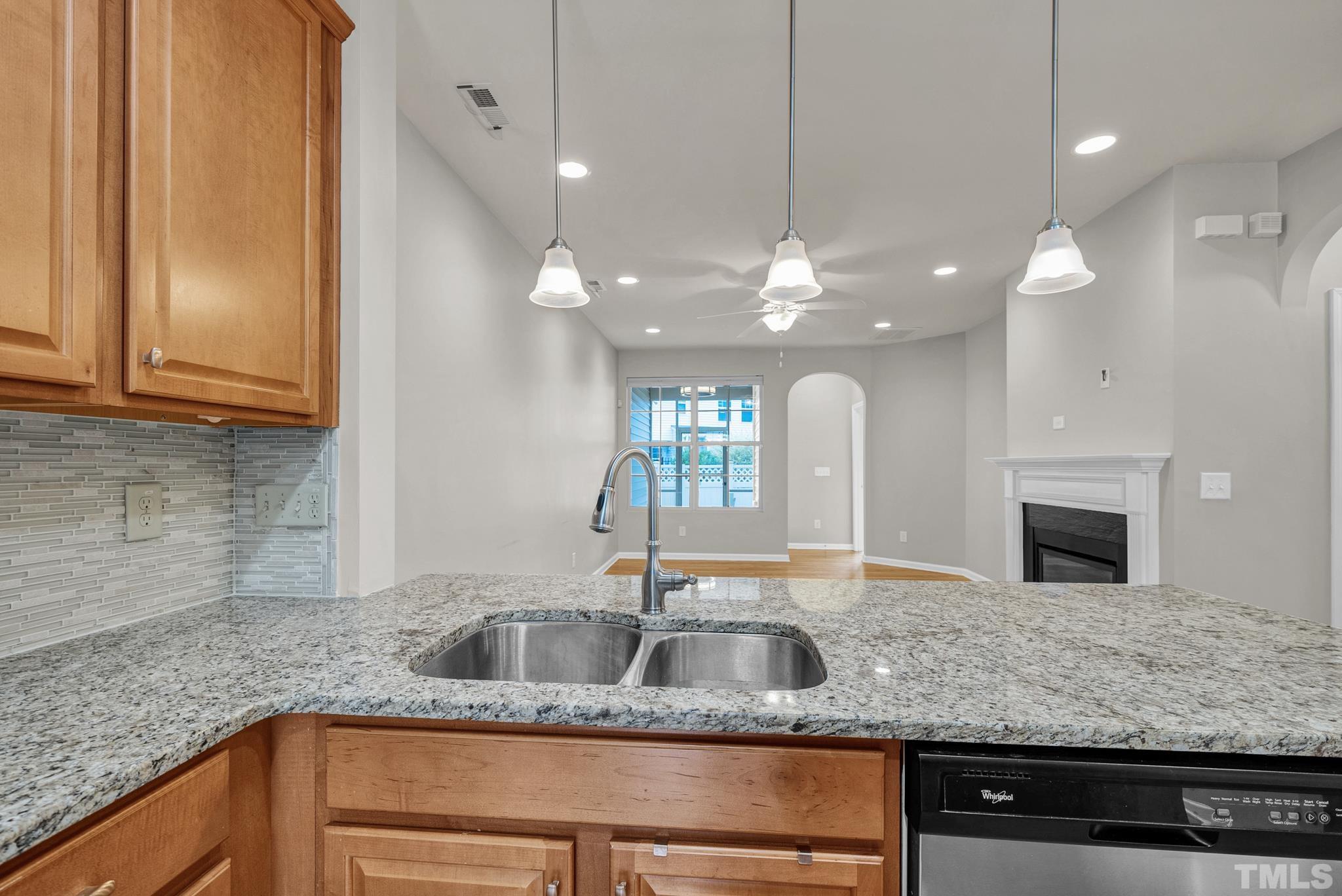 5 Intuition Circle Durham, NC 27705 - Photo 9 of 31 a kitchen with granite countertop a sink a counter space and cabinets