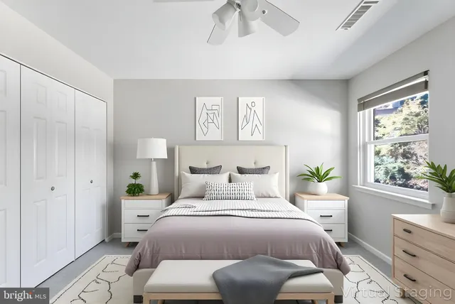 a bedroom with a bed and a window