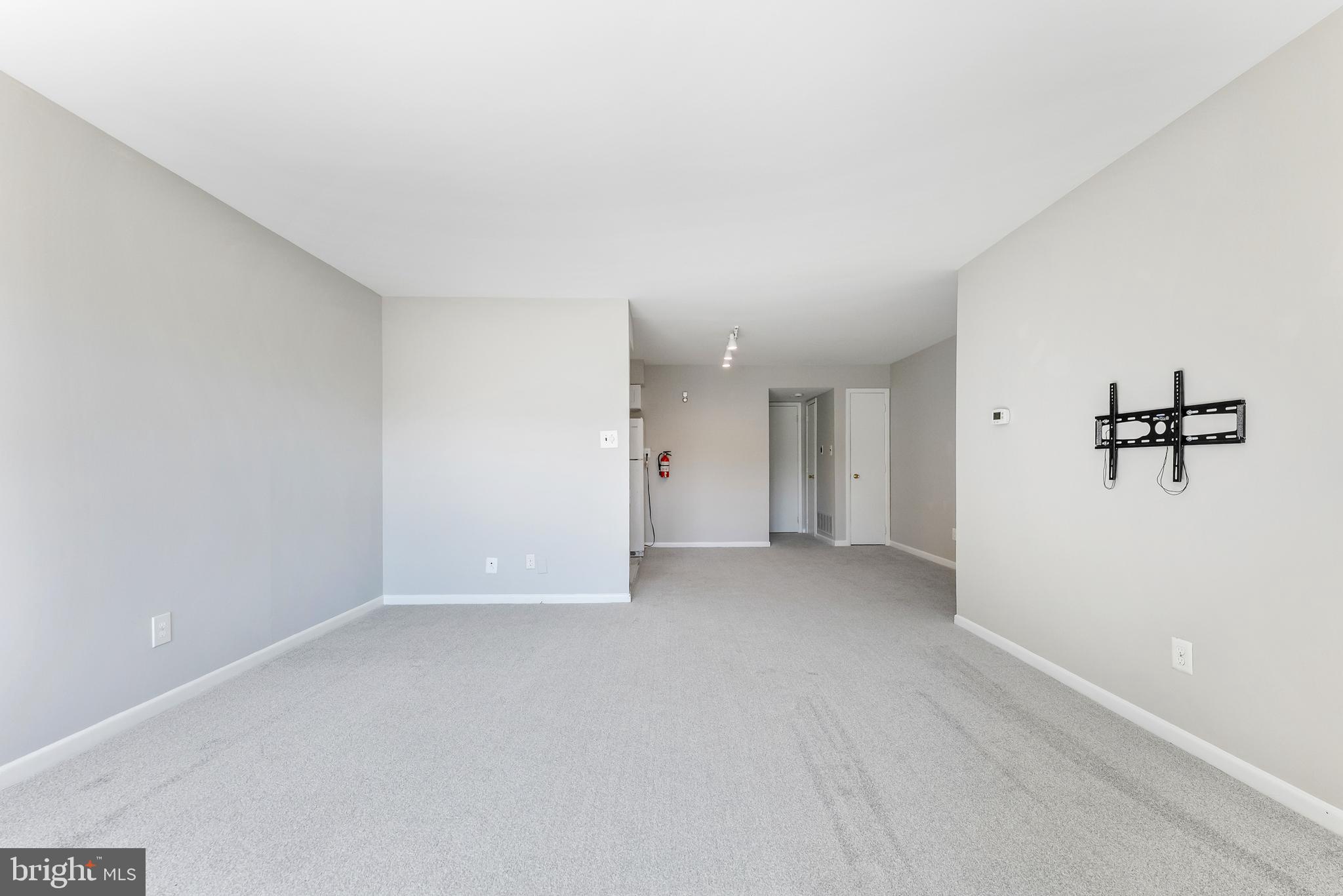 406 Winding Way Westville, NJ 08093 - Photo 2 of 20 a view of a big room with closet and windows