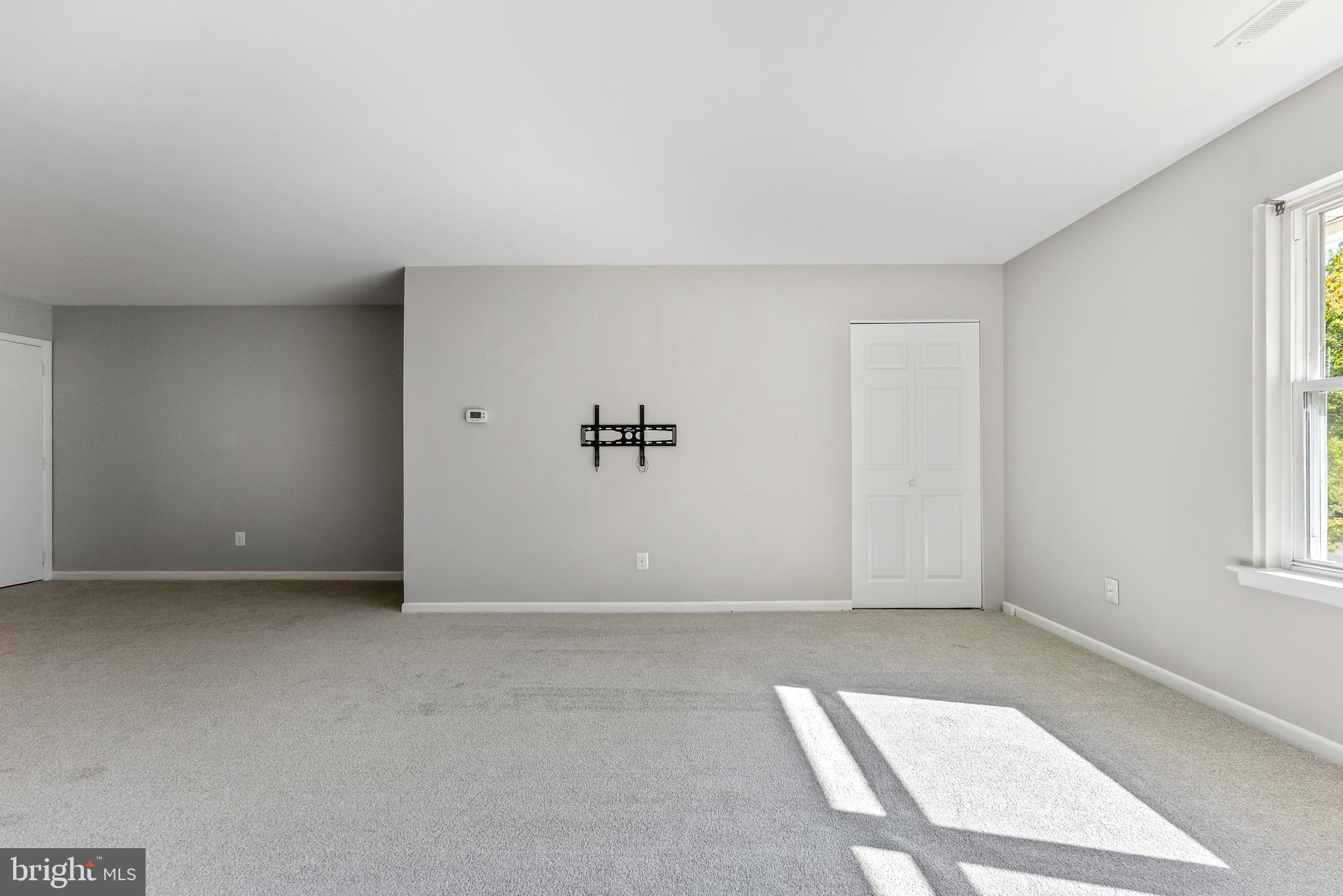 406 Winding Way Westville, NJ 08093 - Photo 3 of 20 an empty room with windows