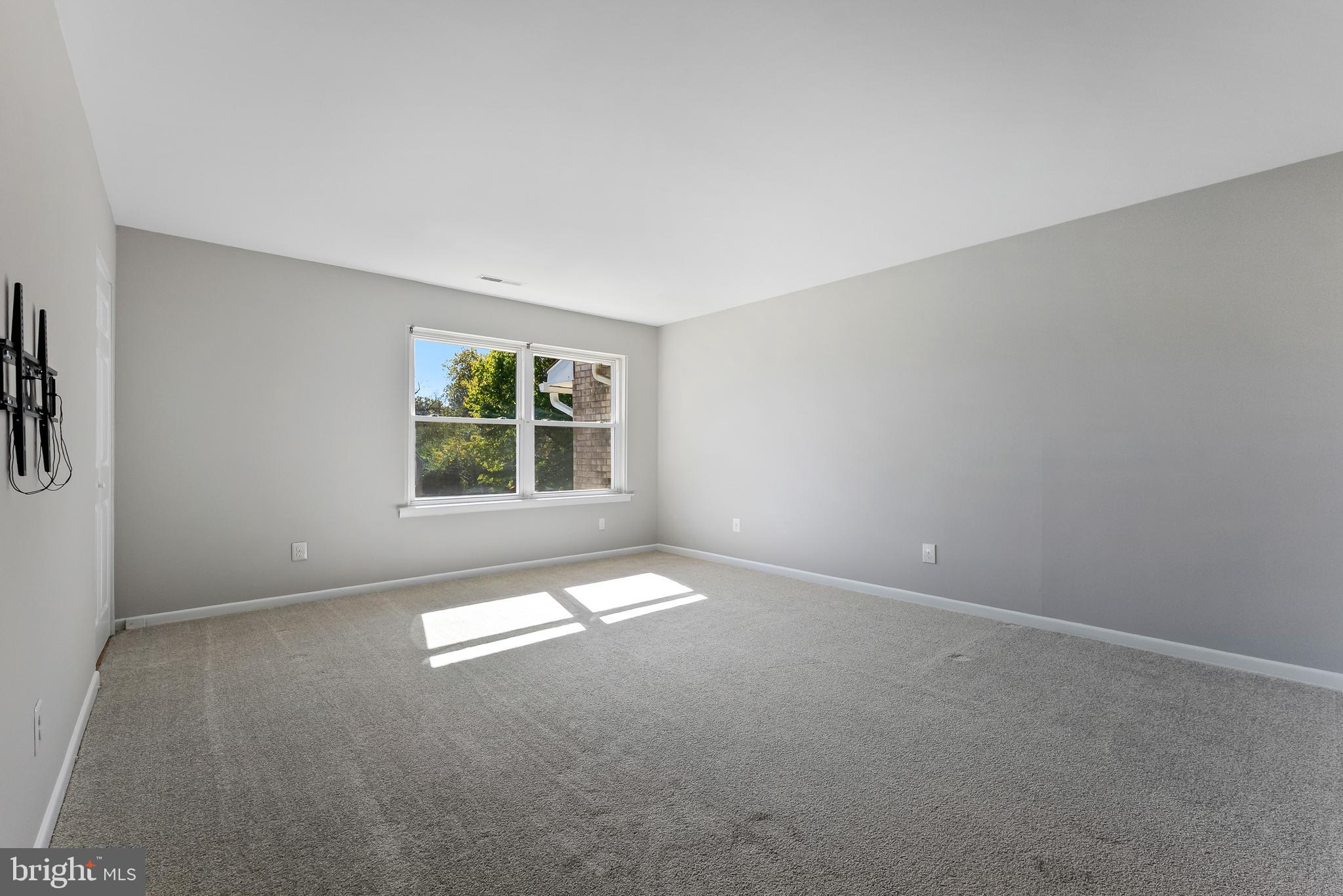 406 Winding Way Westville, NJ 08093 - Photo 4 of 20 an empty room with windows