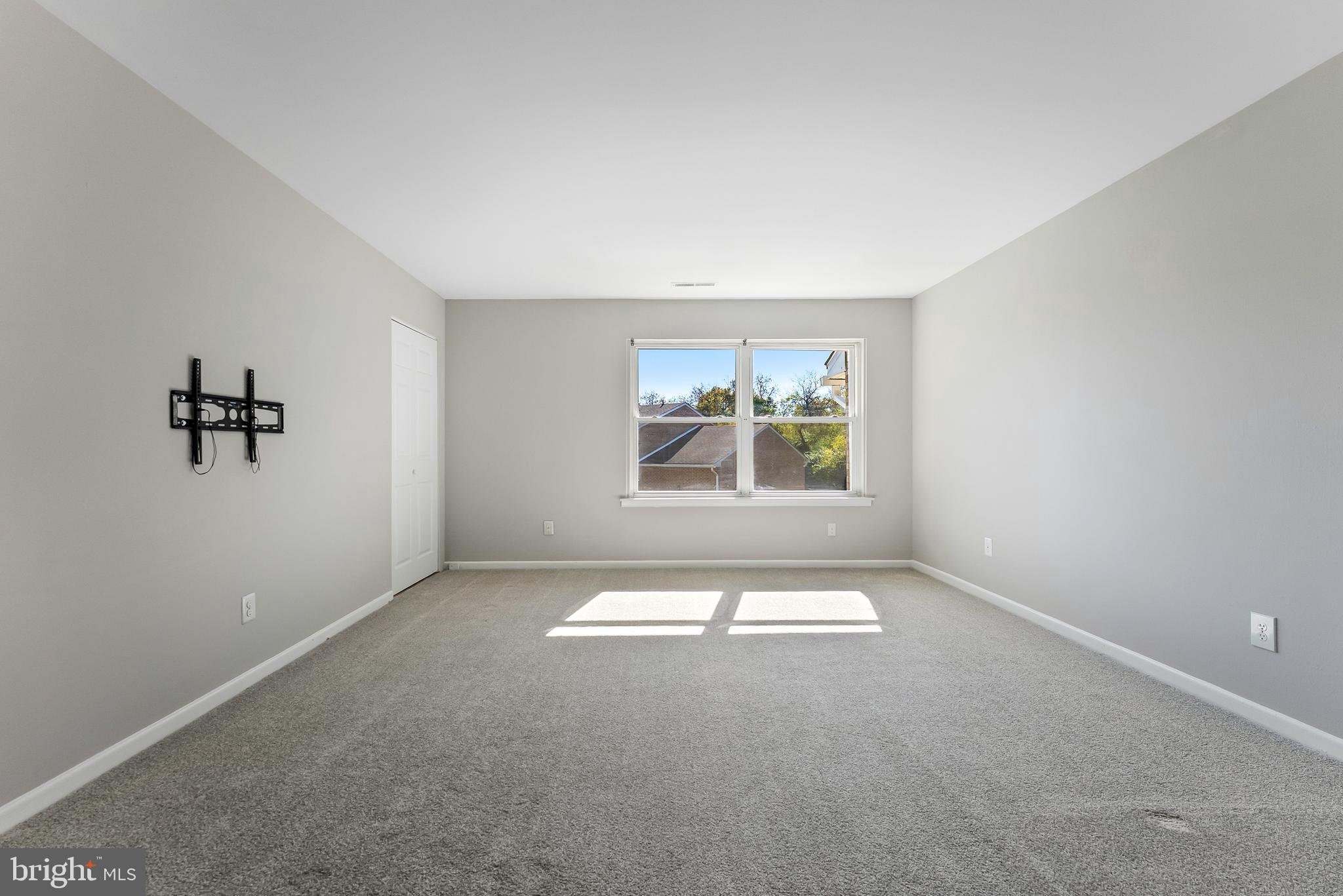 406 Winding Way Westville, NJ 08093 - Photo 5 of 20 an empty room with windows