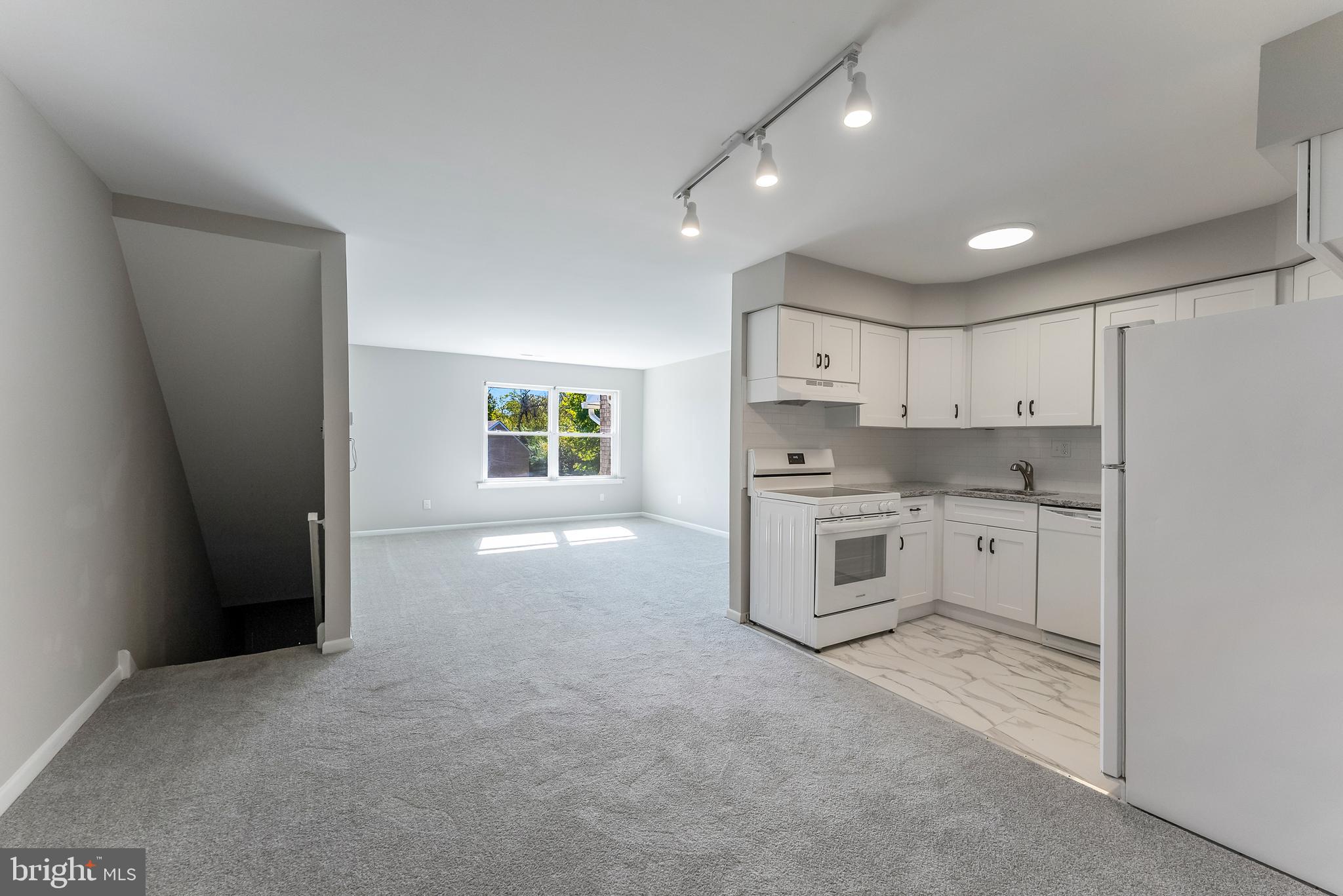 406 Winding Way Westville, NJ 08093 - Photo 10 of 20 a kitchen with white cabinets and white appliances