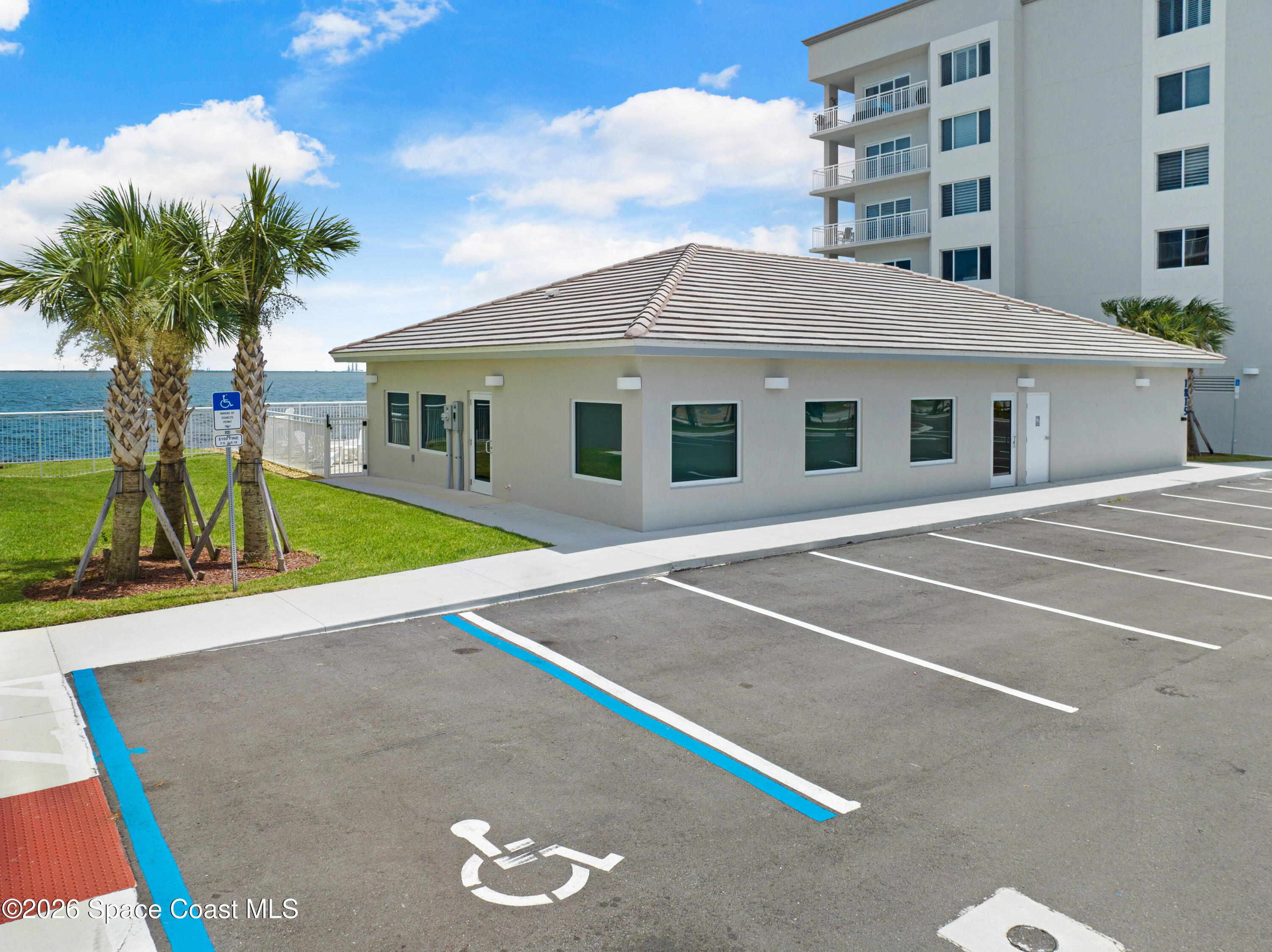 1805 Riverside Drive, Unit 304 Titusville, FL 32780 - Photo 46 of 46 a front view of a house with a yard