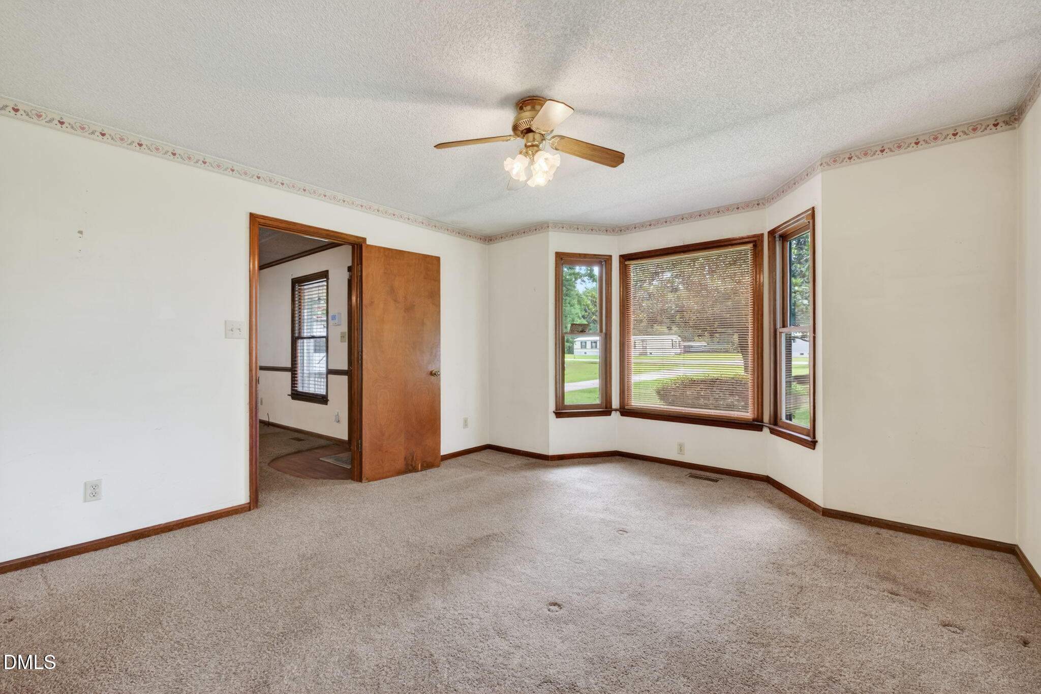 350 Grantham School Road Goldsboro, NC 27530 - Photo 14 of 49 a view of a livingroom with a ceiling fan and window
