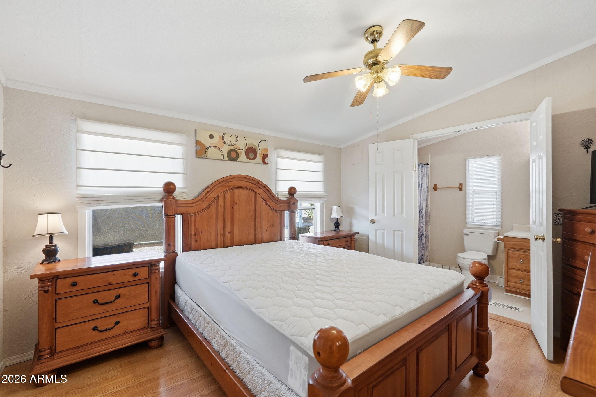 53 North Mountain Road, Unit 38 Apache Junction, AZ 85120 - Photo 17 of 35 a bedroom with a bed and a chandelier