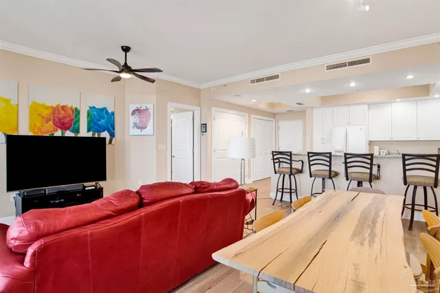 a room with furniture and a flat screen tv