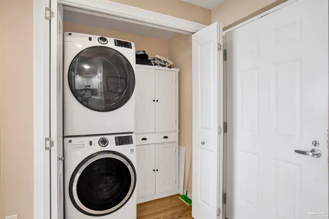 a view of a hallway with washer and dryer