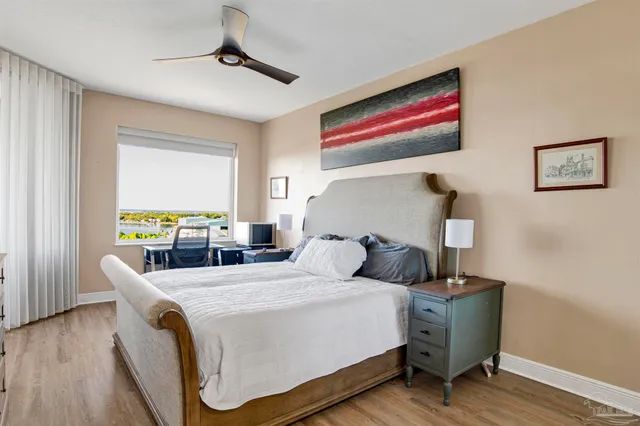 a bedroom with bed and a window