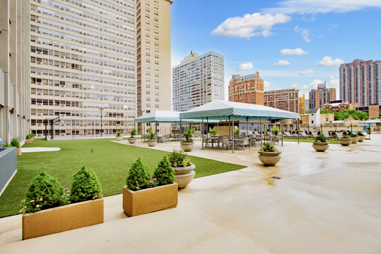 655 West Irving Park Road, Unit 4407 Chicago, IL 60613 - Photo 15 of 19 a view of swimming pool with outdoor seating and plants