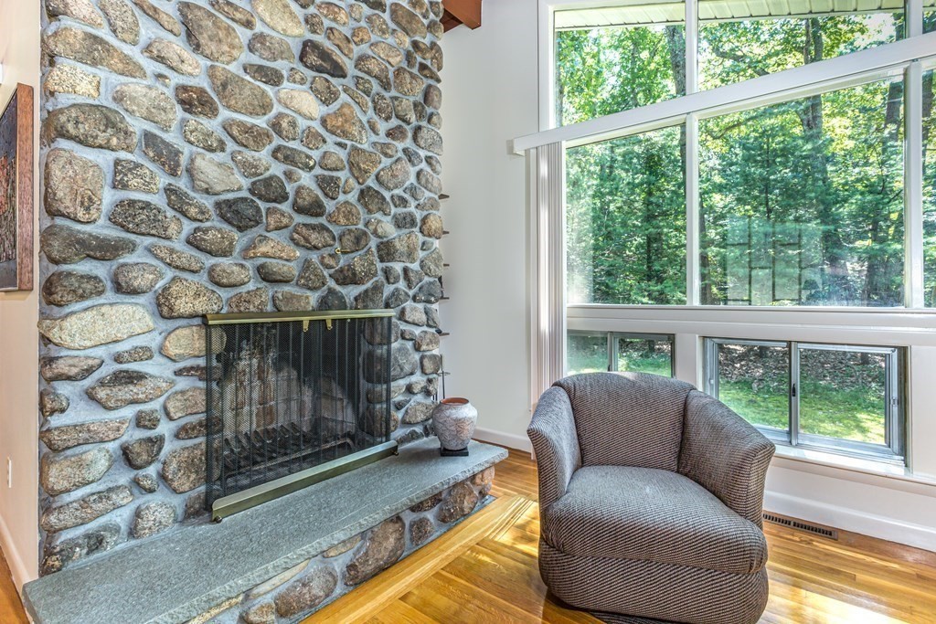 32 Spring Lane Sharon, MA 02067 - Photo 4 of 37 a living room with furniture and a fireplace