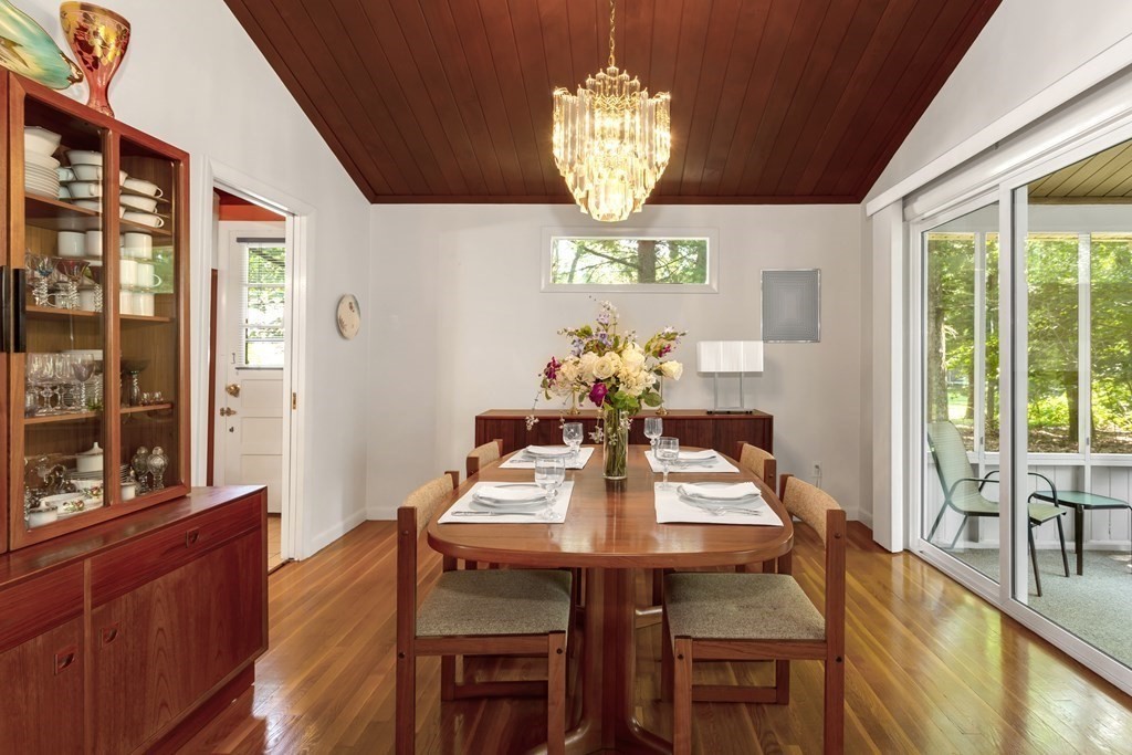 32 Spring Lane Sharon, MA 02067 - Photo 6 of 37 a view of a dining room with furniture a chandelier and wooden floor