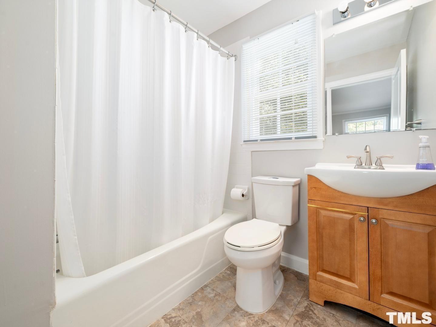 214 Faircloth Street Raleigh, NC 27607 - Photo 14 of 21 a bathroom with a sink toilet and shower