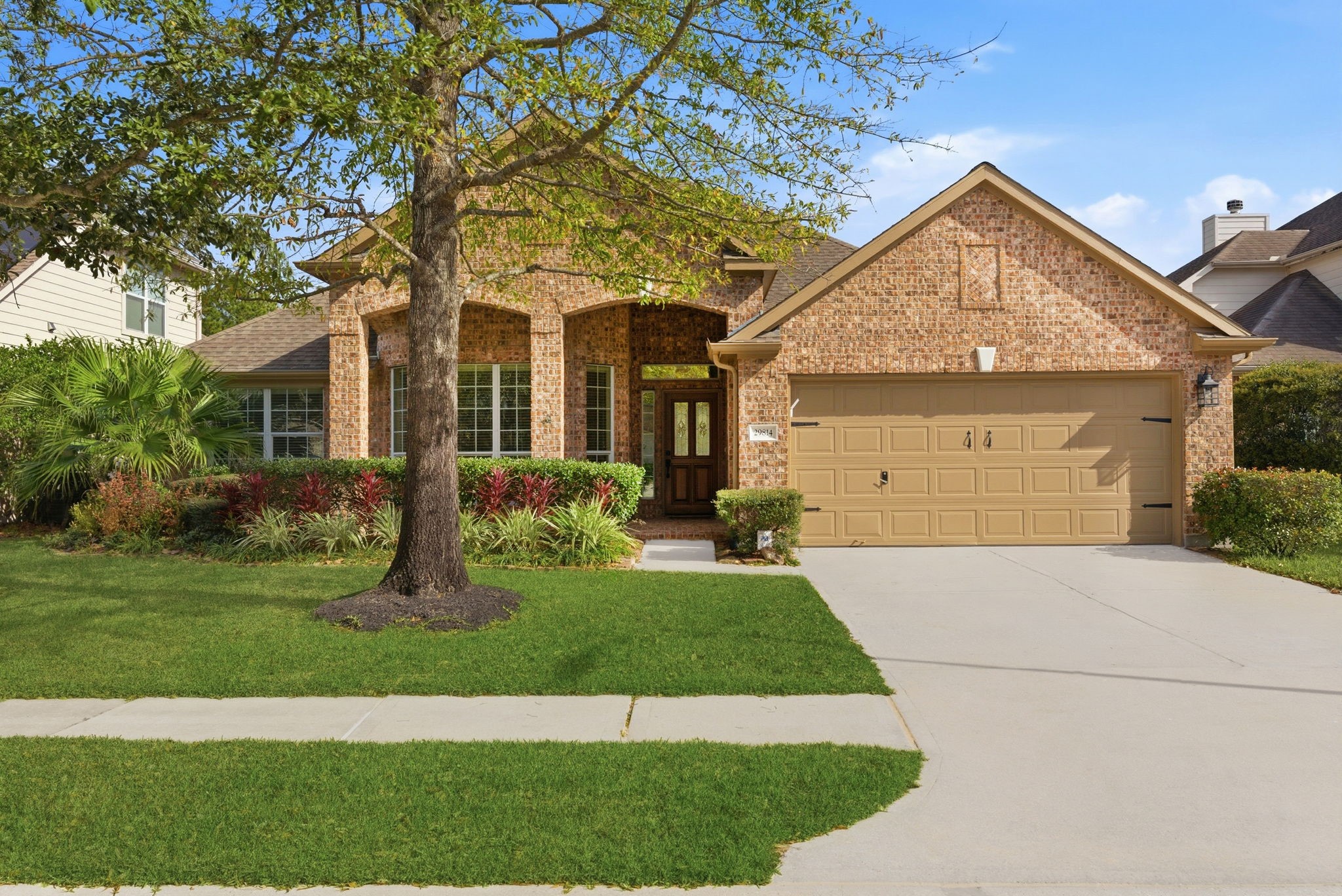 29814 Legends Pass Lane Spring, TX 77386 - Photo 3 of 46 a front view of a house with a yard