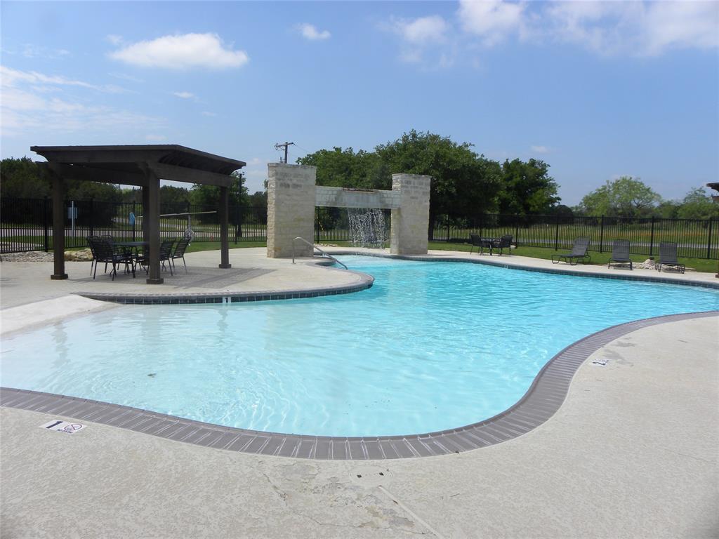 1303 Ash Court Whitney, TX 76692 - Photo 11 of 13 a view of a swimming pool with a patio