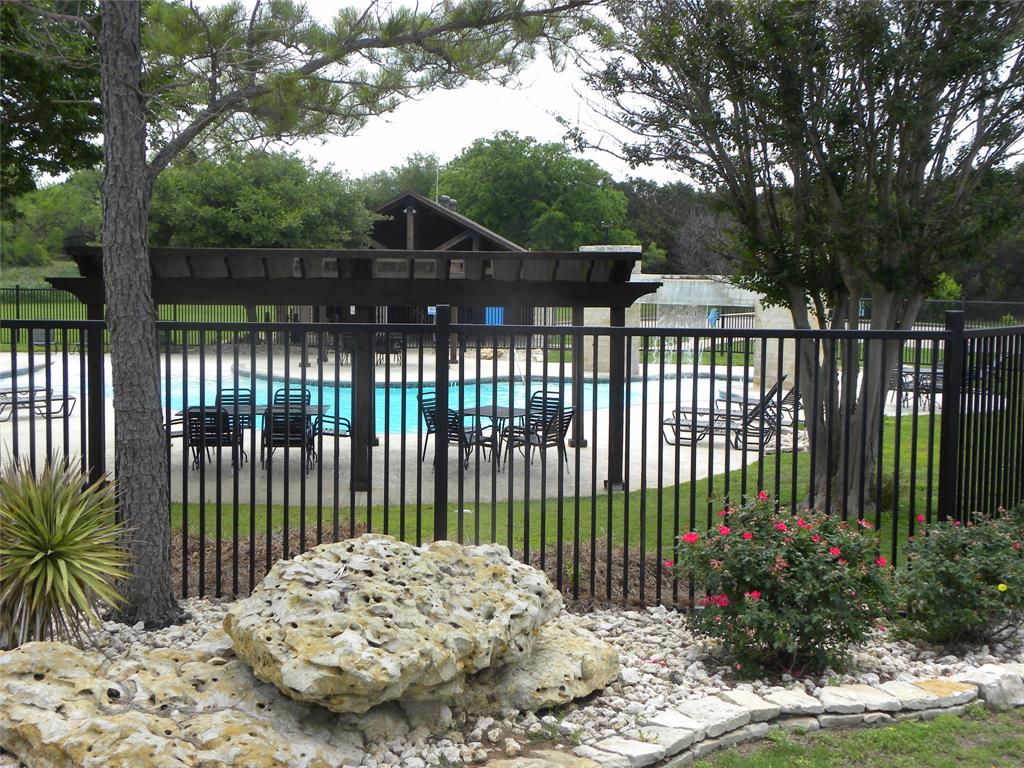 1303 Ash Court Whitney, TX 76692 - Photo 13 of 13 a view of a wrought iron fences in front of house
