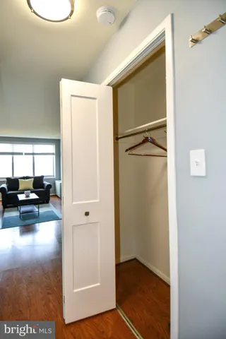 a view of a livingroom with a furniture and floor to ceiling window