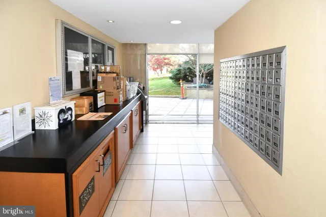 a kitchen with granite countertop a sink and a stove