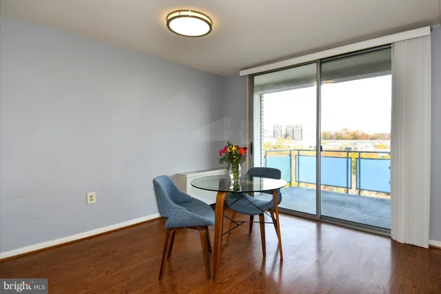 a view of a room with a furniture and floor to ceiling window