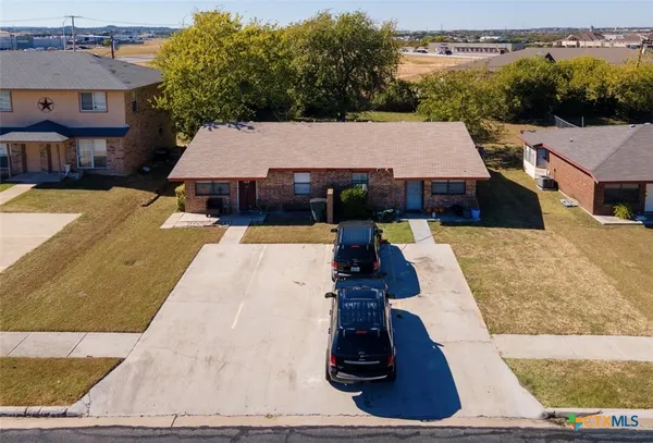 an aerial view of a house with entertaining space