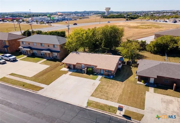 an aerial view of a house with lake view