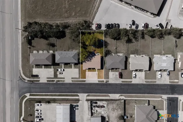 large glass top table and chairs in a room