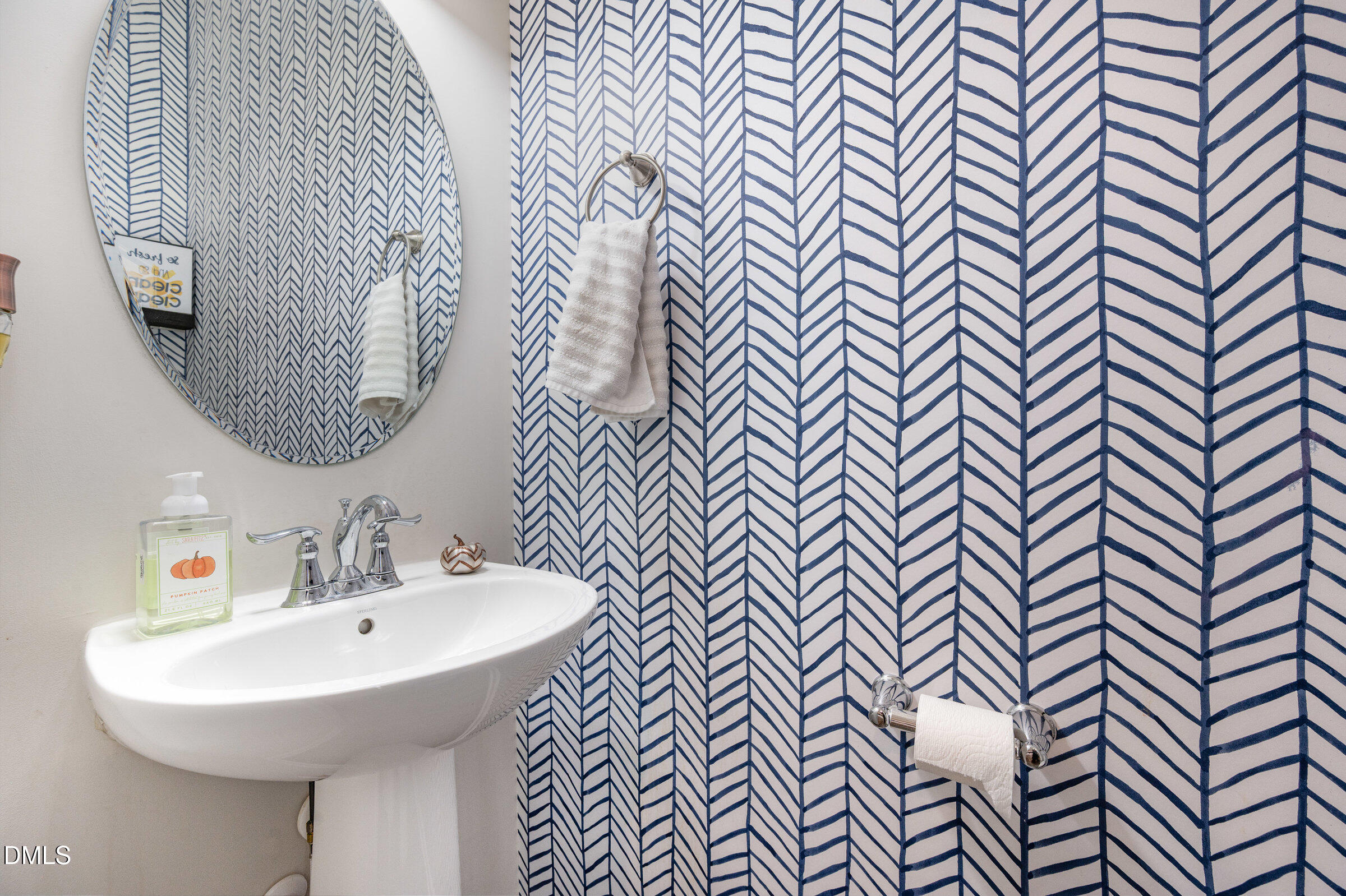 372 Amber Acorn Avenue Raleigh, NC 27603 - Photo 11 of 49 a bathroom with a sink a mirror and shower