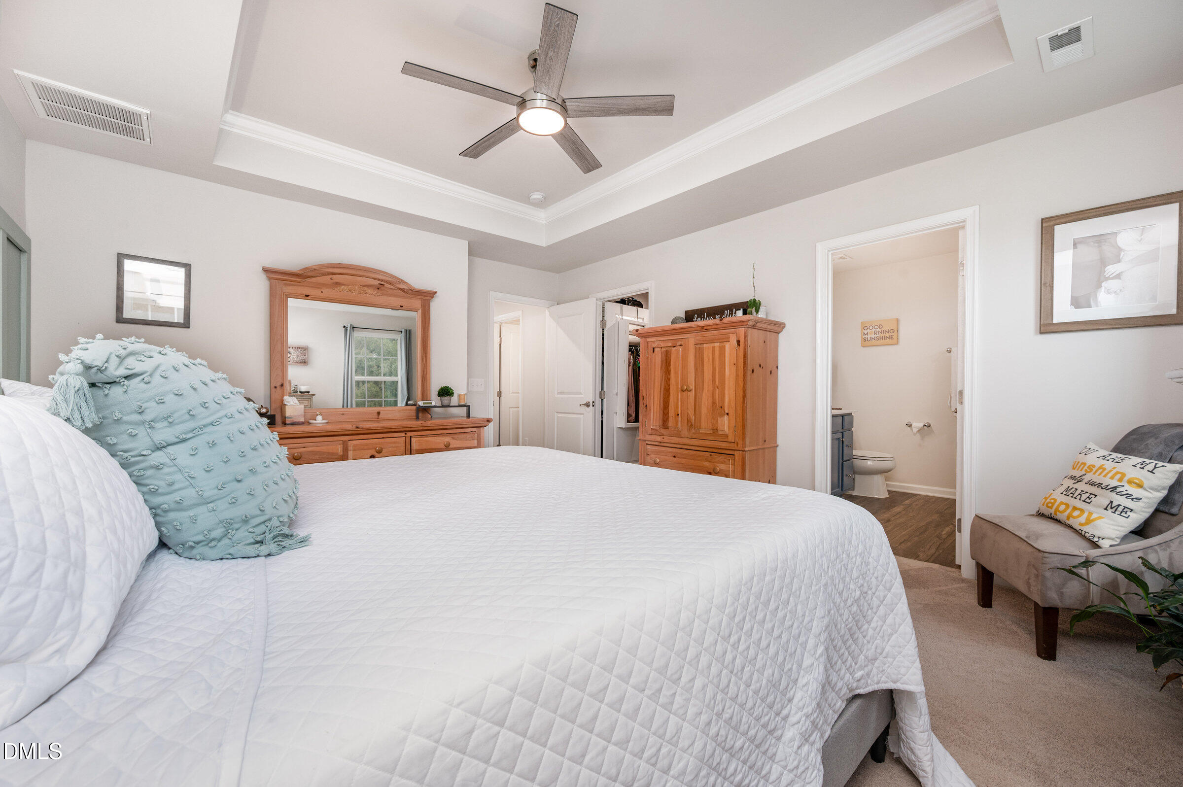 372 Amber Acorn Avenue Raleigh, NC 27603 - Photo 13 of 49 a spacious bedroom with a bed and a dresser