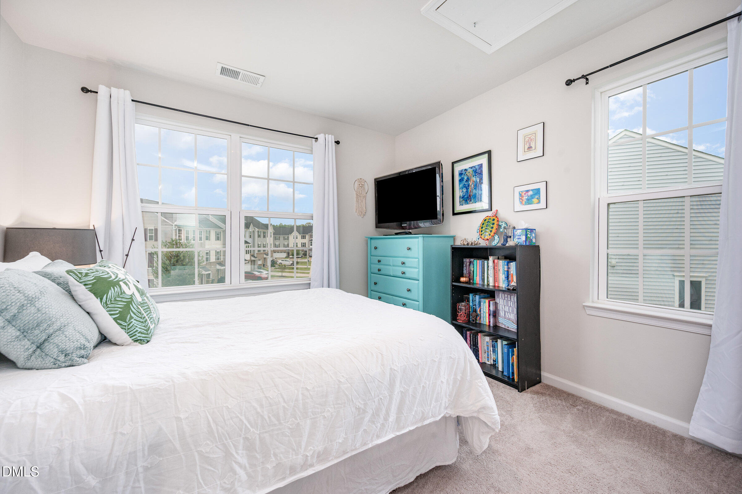 372 Amber Acorn Avenue Raleigh, NC 27603 - Photo 16 of 49 a bedroom with a bed and a flat screen tv