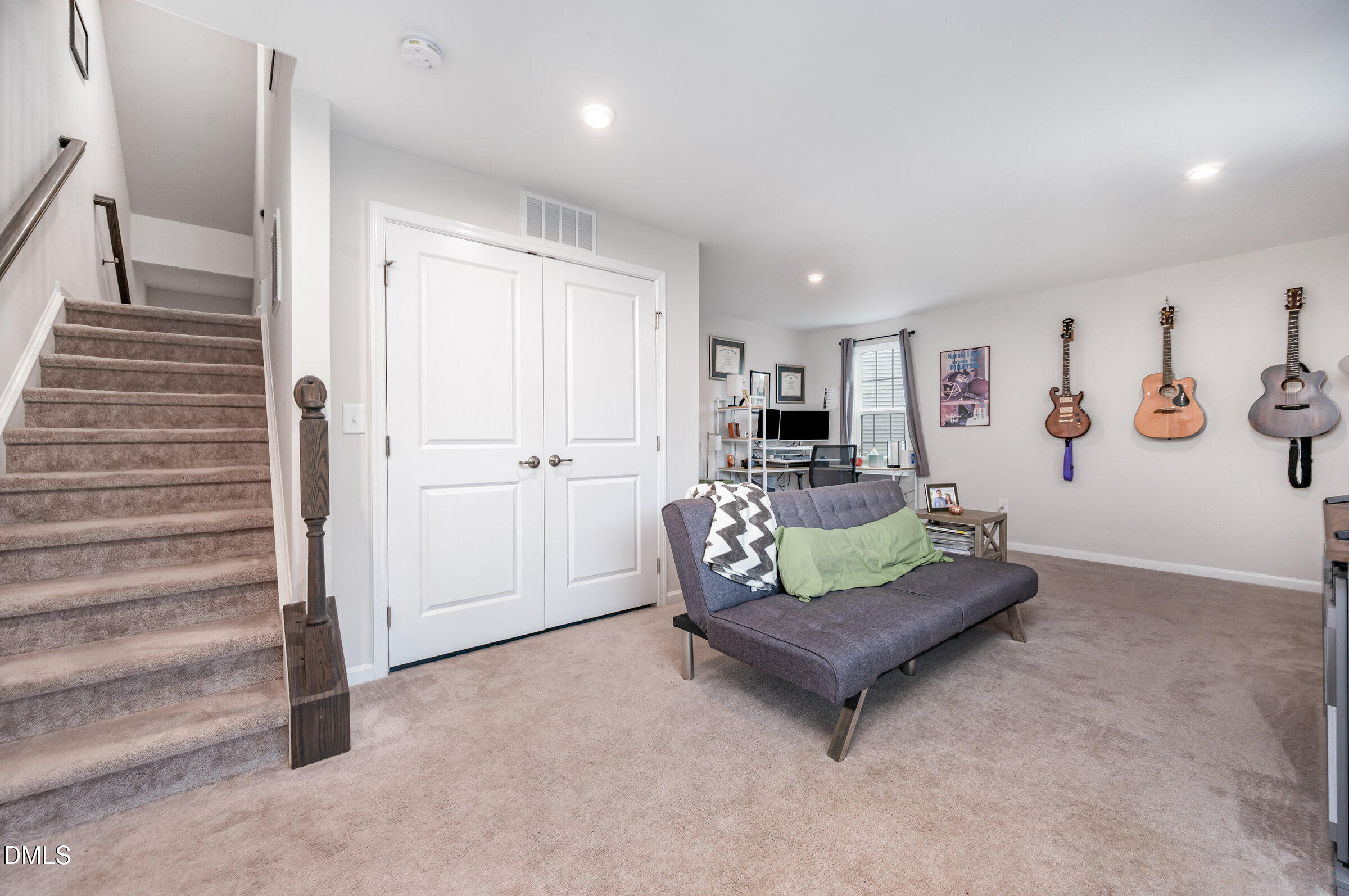 372 Amber Acorn Avenue Raleigh, NC 27603 - Photo 19 of 49 a living room with furniture and a wooden floor