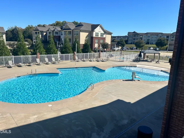 a view of a balcony with furniture