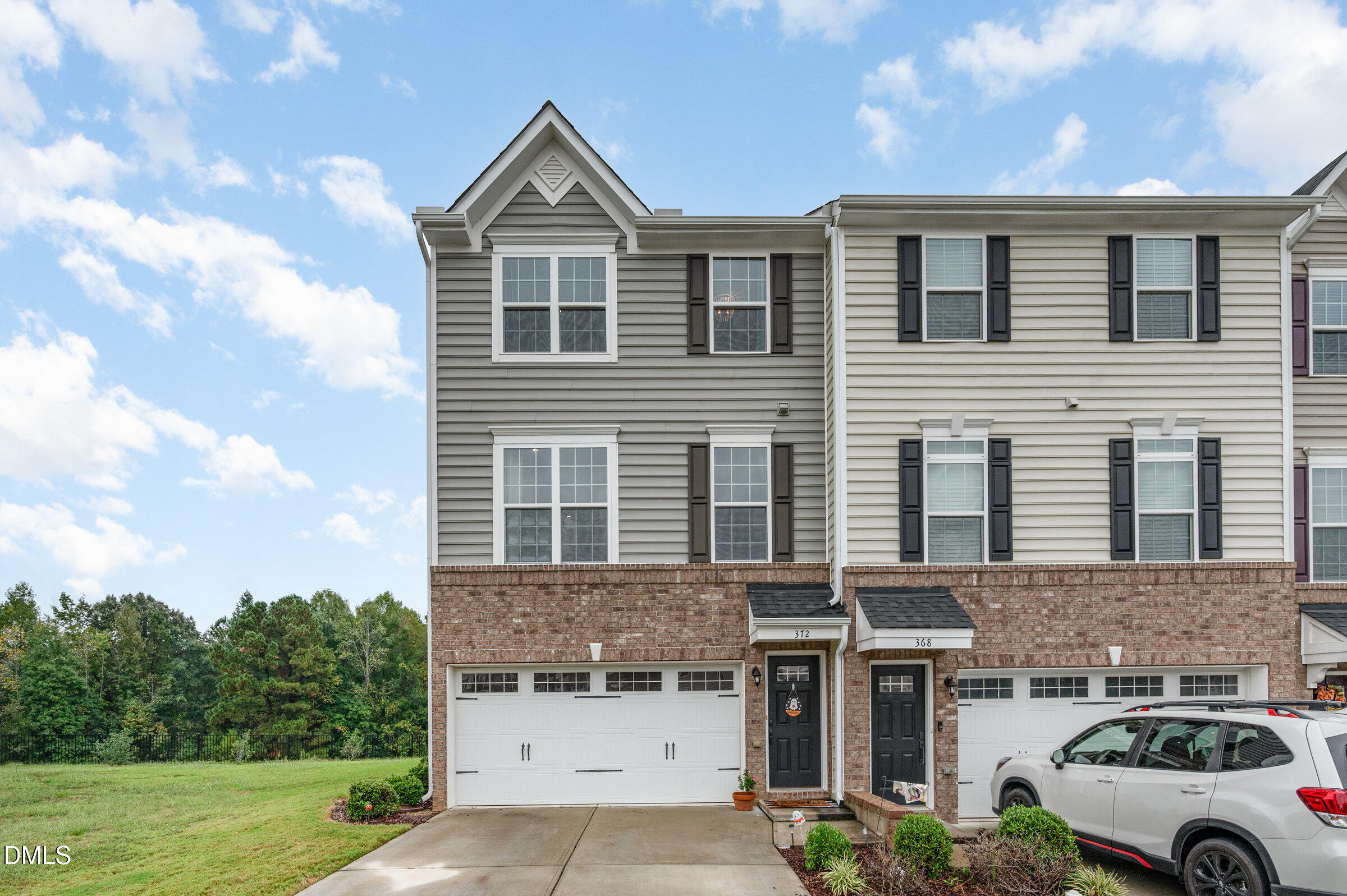 372 Amber Acorn Avenue Raleigh, NC 27603 - Photo 2 of 49 a front view of a house with a yard