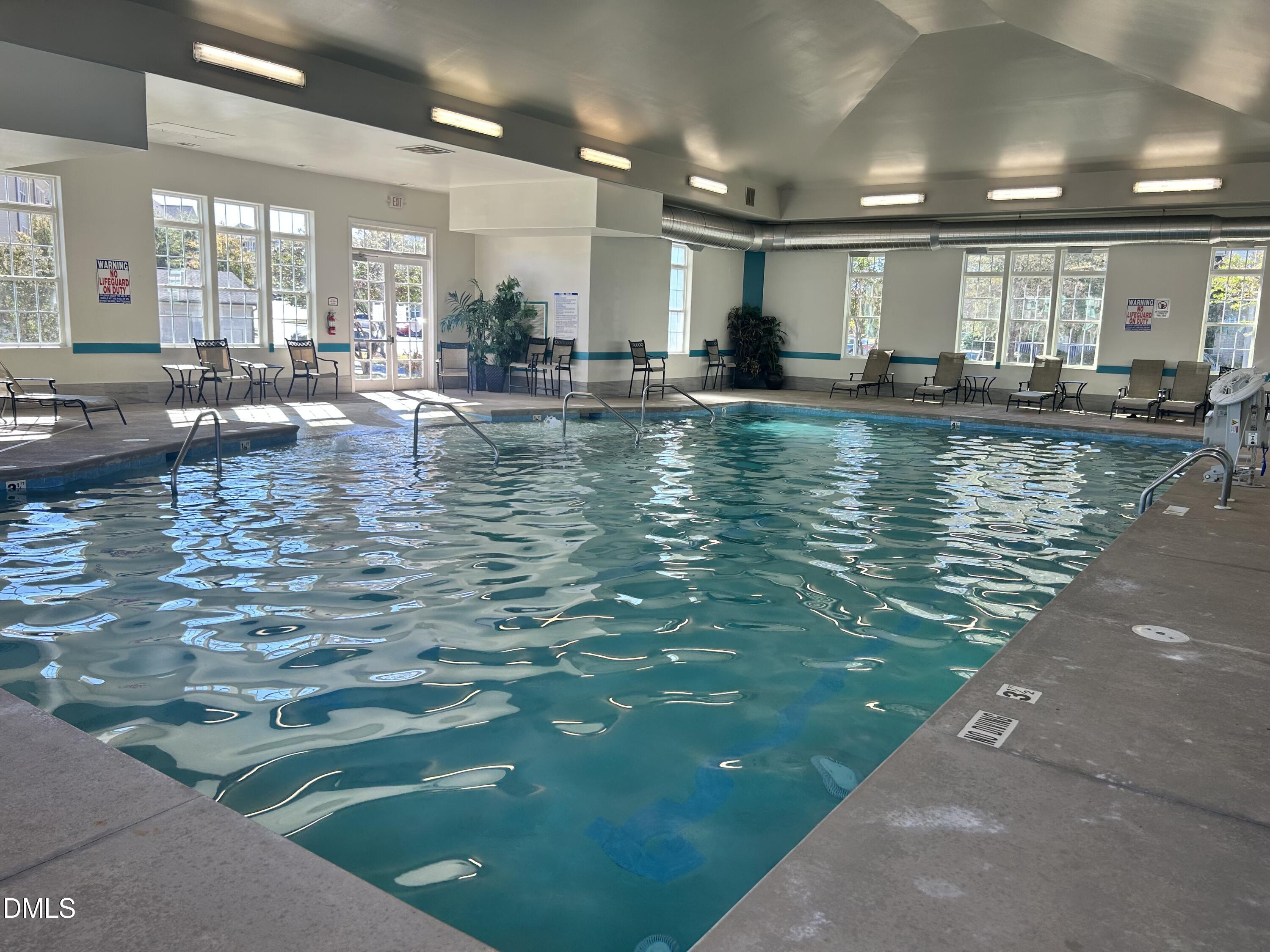 372 Amber Acorn Avenue Raleigh, NC 27603 - Photo 28 of 49 a view of a kitchen with kitchen island stainless steel appliances lots of counter space