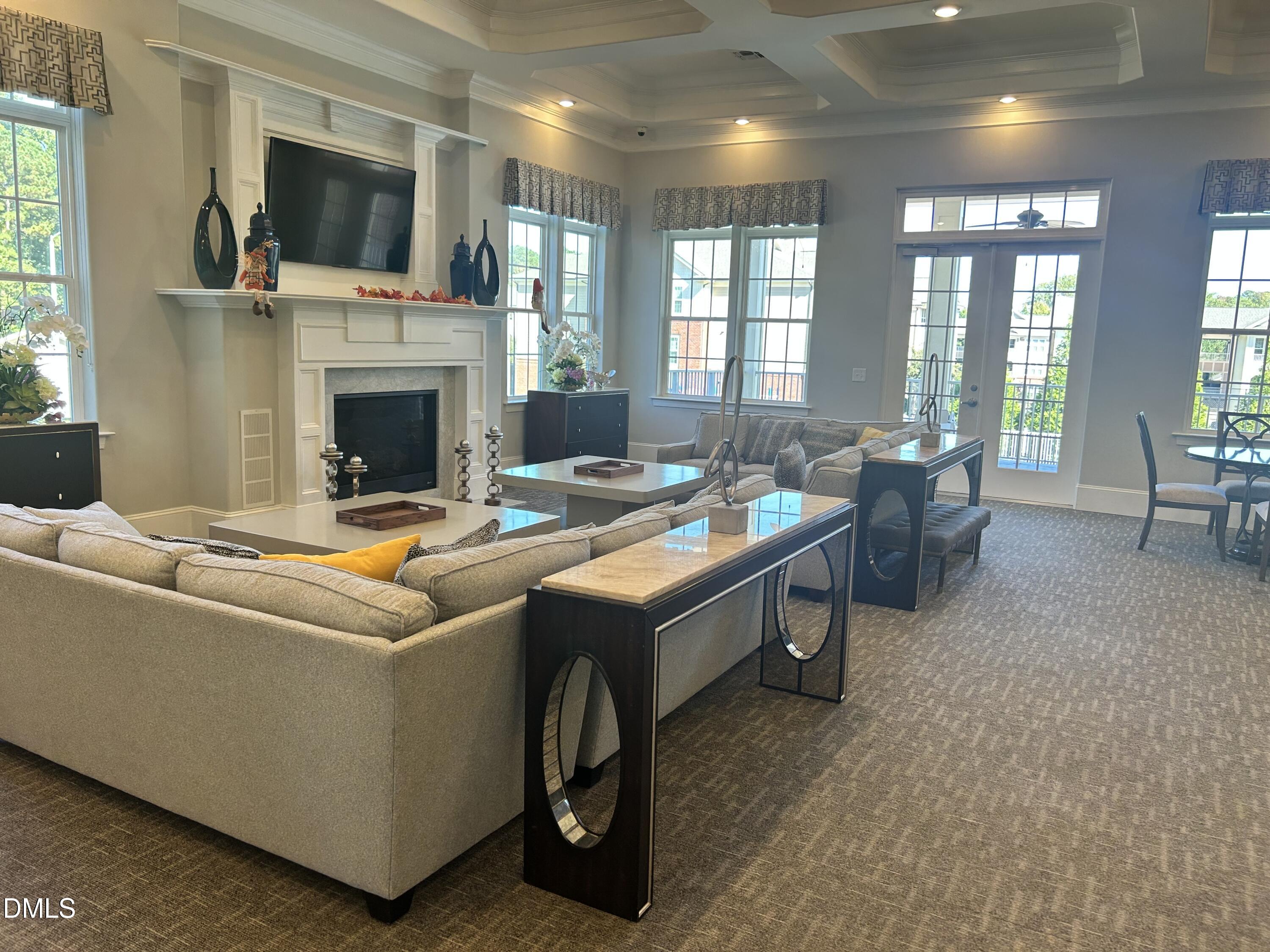 372 Amber Acorn Avenue Raleigh, NC 27603 - Photo 33 of 49 a living room with furniture fireplace and flat screen tv